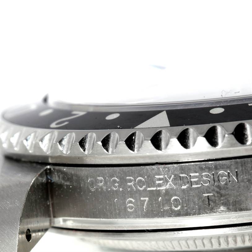 The image shows a close-up of the bezel and engraving on the side case of a Rolex GMT-Master 16710 Men
s Stainless Steel Black Dial 16710 Men
s Stainless Steel Black Dial watch, emphasizing the model number and design details.
