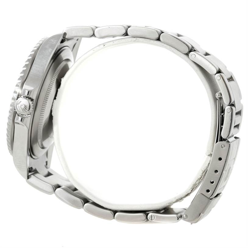 The image shows a side view of a Rolex GMT-Master 16710 Men
s Stainless Steel Black Dial 16710 Men
s Stainless Steel Black Dial wristwatch, highlighting the case, crown, and metal bracelet.