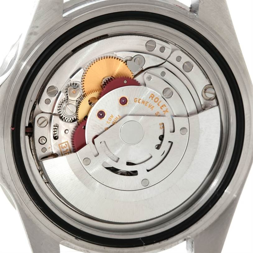 This image shows the internal mechanism of the Rolex GMT-Master 16710 Men
s Stainless Steel Black Dial 16710 Men
s Stainless Steel Black Dial watch, focusing on its intricate gears and movement parts.