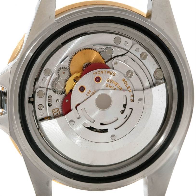 This image shows the movement and internal components of a Rolex GMT-Master 16713 Men's Stainless Steel Brown Dial 16713 Men's Stainless Steel Brown Dial watch from a back view angle.