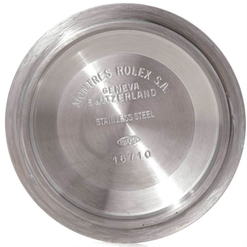 This image shows the rear case back of a Rolex GMT-Master 16713 Men's Stainless Steel Brown Dial 16713 Men's Stainless Steel Brown Dial model watch with inscriptions.