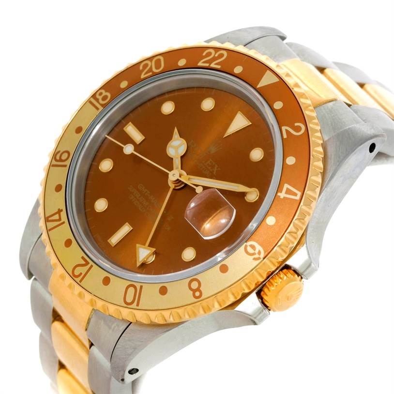 This image shows a close-up side angle of a Rolex GMT-Master 16713 Men's Stainless Steel Brown Dial 16713 Men's Stainless Steel Brown Dial watch displaying the dial, bezel, crown, and part of the bracelet.