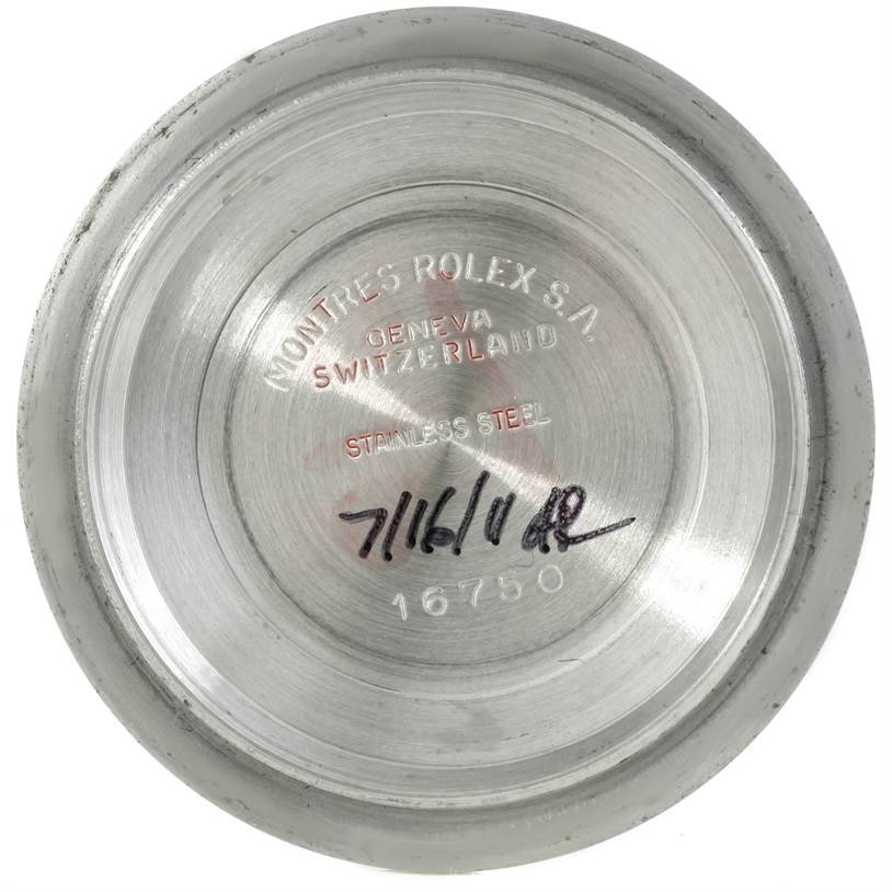 This image shows the inside case back of a Rolex GMT-Master 16750 Men's Stainless Steel Black Dial 16750 Men's Stainless Steel Black Dial model, showcasing its markings and serial number.