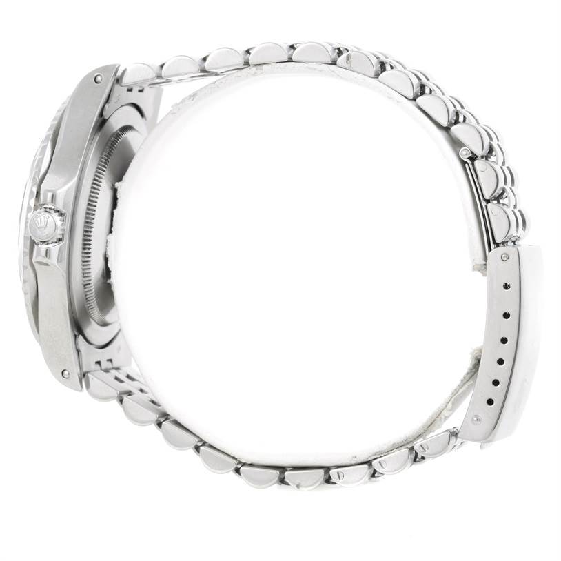 The image shows the side profile of a Rolex GMT-Master 16750 Men's Stainless Steel Black Dial 16750 Men's Stainless Steel Black Dial watch, highlighting the case, crown, and bracelet.