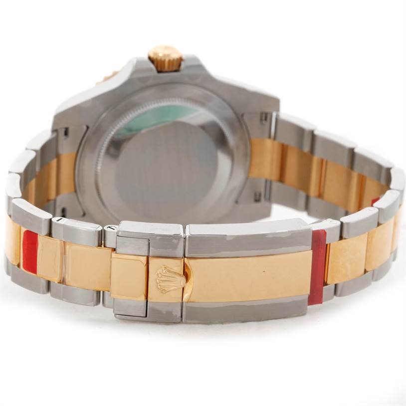 This image shows the rear view of a Rolex GMT-Master 116713 Men's Stainless Steel Black Dial 116713 Men's Stainless Steel Black Dial watch, highlighting its case back and two-tone bracelet.