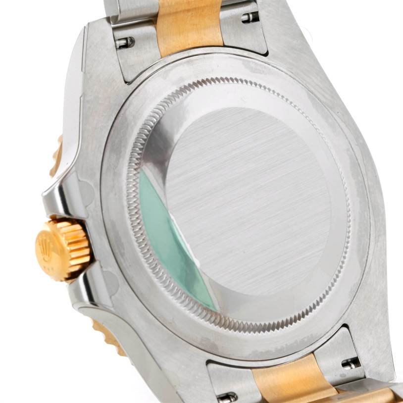 The image shows the case back and part of the bracelet of a Rolex GMT-Master 116713 Men's Stainless Steel Black Dial 116713 Men's Stainless Steel Black Dial watch from a rear angle.