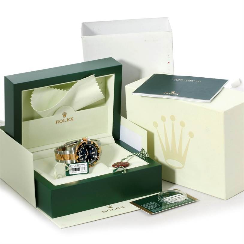 This is a Rolex GMT-Master 116713 Men's Stainless Steel Black Dial 116713 Men's Stainless Steel Black Dial watch viewed from the top, shown with its box, manuals, and tags.