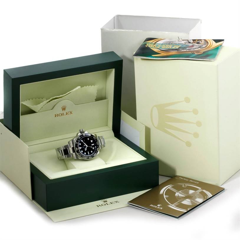 This image shows a Rolex GMT-Master 116710 Men
s Stainless Steel Black Dial 116710 Men
s Stainless Steel Black Dial watch in its box, along with the outer box and accompanying booklets.