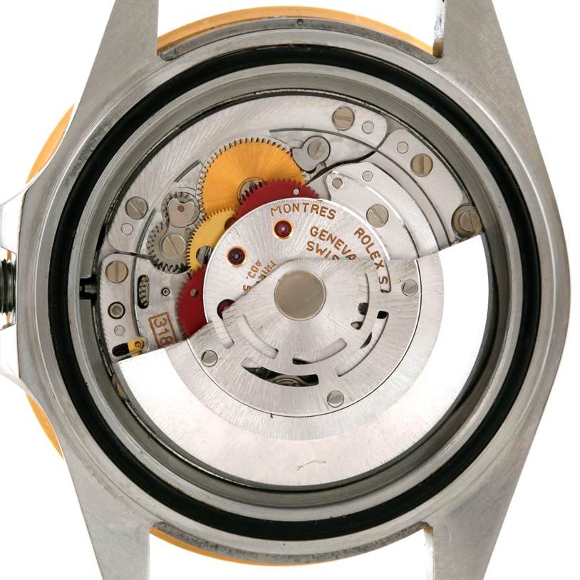 The image shows the internal mechanical movement of a Rolex GMT-Master 16713 Men
s Stainless Steel Black Dial 16713 Men
s Stainless Steel Black Dial watch from the back.