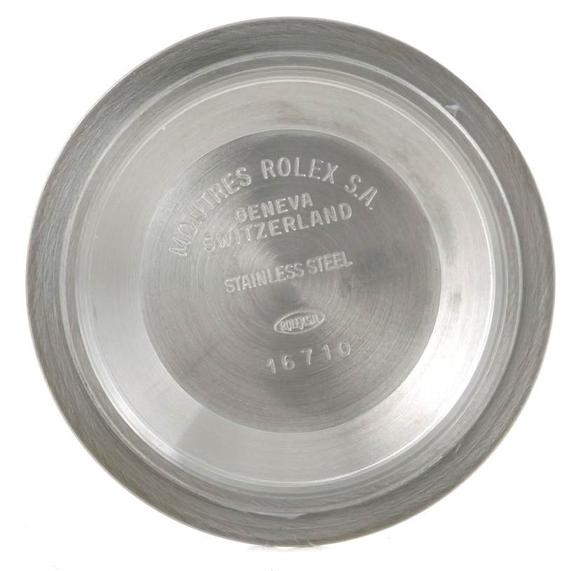 This image shows the case back of a Rolex GMT-Master 16713 Men
s Stainless Steel Black Dial 16713 Men
s Stainless Steel Black Dial model, displaying details like "Rolex S.A. Geneva, Switzerland" and the stainless steel material.