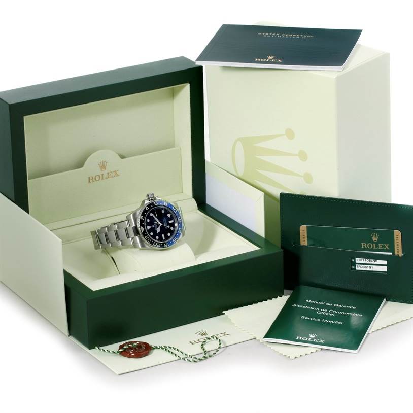 The Rolex GMT-Master 116710 Men's Stainless Steel Black Dial 116710 Men's Stainless Steel Black Dial watch is shown from the front, displayed in its open box with manuals, a warranty card, and a tag.