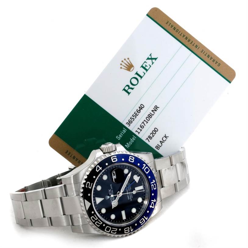 The image shows a Rolex GMT-Master 116710 Men's Stainless Steel Black Dial 116710 Men's Stainless Steel Black Dial watch angled to display the face and bracelet, along with a Rolex warranty card.