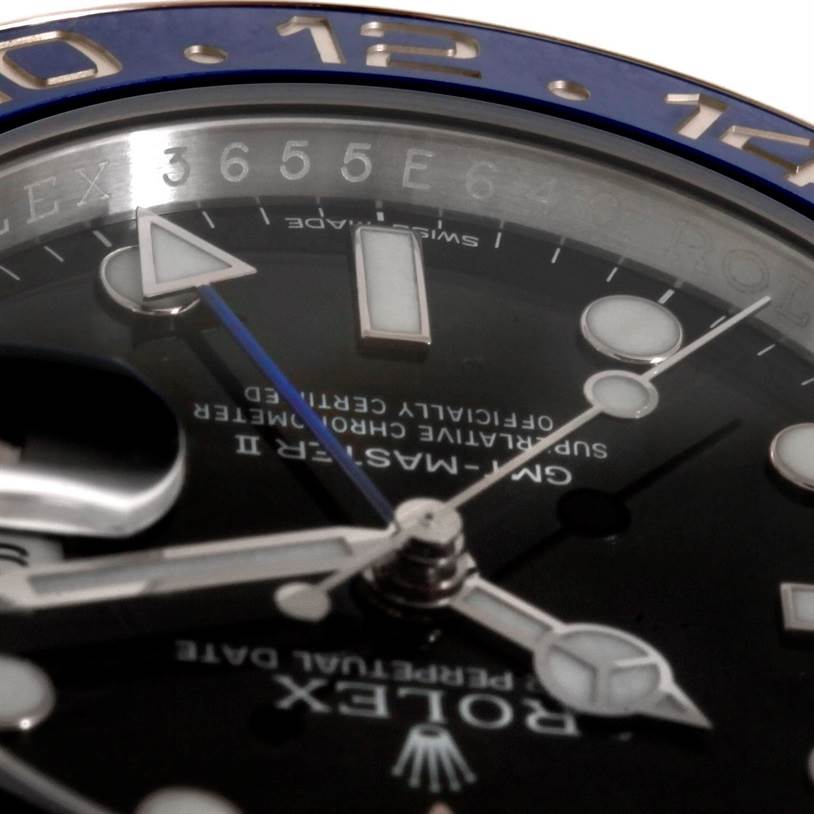This close-up image of a Rolex GMT-Master 116710 Men's Stainless Steel Black Dial 116710 Men's Stainless Steel Black Dial II watch shows the dial, hands, and part of the bezel.