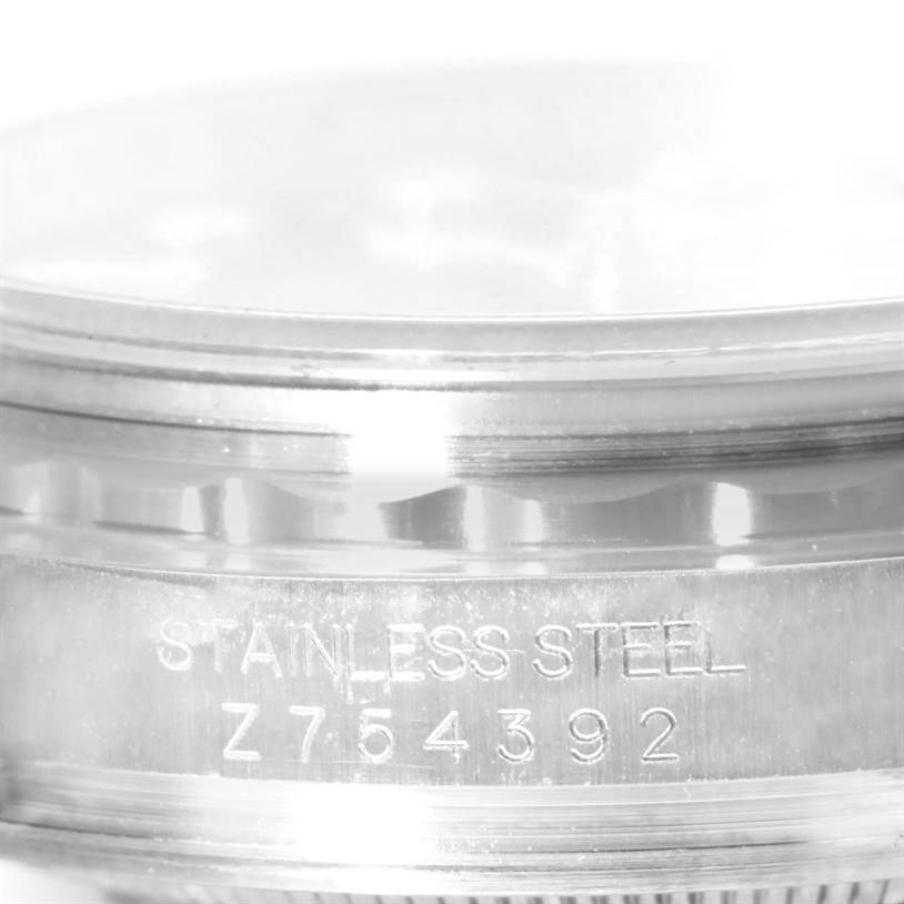 The image shows a close-up of the stainless steel rim with model number engraving on a Rolex GMT-Master 116713 Men's Stainless Steel Black Dial 116713 Men's Stainless Steel Black Dial watch.