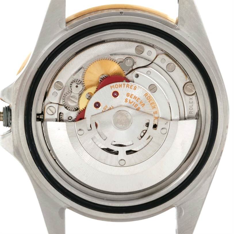 This image shows the Rolex GMT-Master 16713 Men's Stainless Steel Black Dial 16713 Men's Stainless Steel Black Dial's movement, focusing on its intricate internal components from the back.