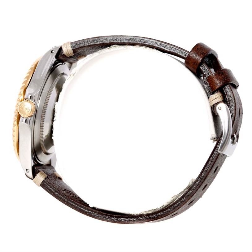 The image shows a side view of a Rolex GMT-Master 16713 Men's Stainless Steel Black Dial 16713 Men's Stainless Steel Black Dial watch with a visible crown and a leather strap.