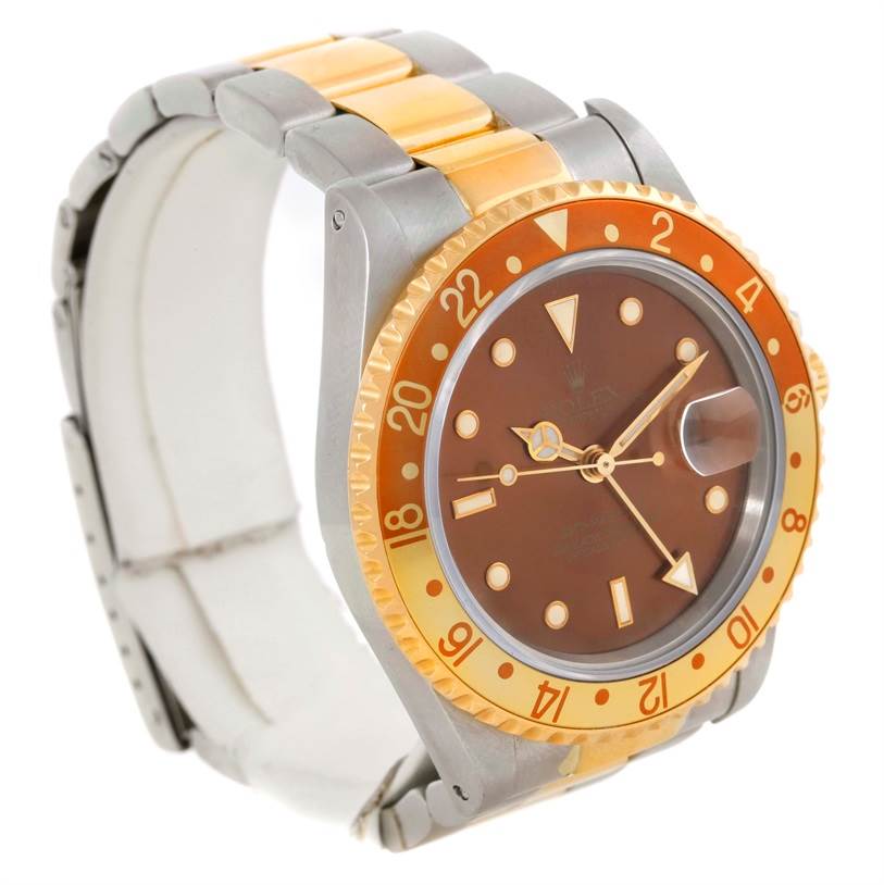 The image shows a Rolex GMT-Master 16713 Men's Stainless Steel Brown Dial 16713 Men's Stainless Steel Brown Dial watch at a slight angle, displaying its face, bezel, and part of the metal and gold bracelet.