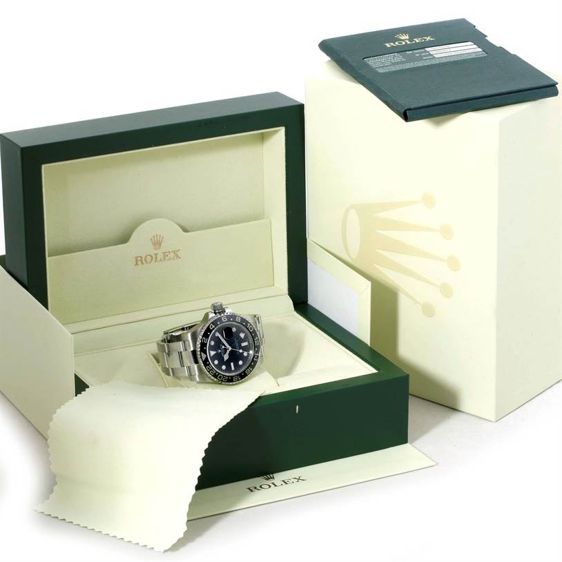 The Rolex GMT-Master 116710 Men's Stainless Steel Black Dial 116710 Men's Stainless Steel Black Dial watch is displayed at a front angle, inside its open box with accompanying accessories.