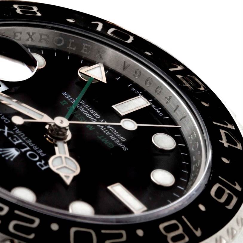 This close-up angle of the Rolex GMT-Master 116710 Men's Stainless Steel Black Dial 116710 Men's Stainless Steel Black Dial watch shows the dial, hands, hour markers, and part of the bezel with the serial number visible.