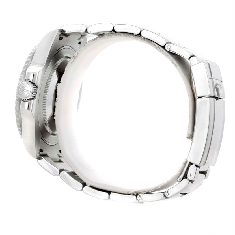 This side view image of the Rolex GMT-Master 116710 Men's Stainless Steel Black Dial 116710 Men's Stainless Steel Black Dial watch showcases the crown, bezel, and steel bracelet links.