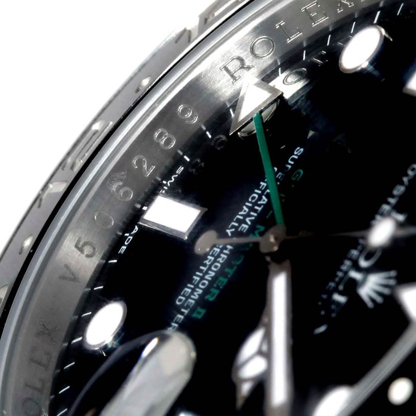 The image shows a close-up of the dial and bezel of a Rolex GMT-Master 116710 Men's Stainless Steel Black Dial 116710 Men's Stainless Steel Black Dial watch, highlighting the brand name and one of the hands.