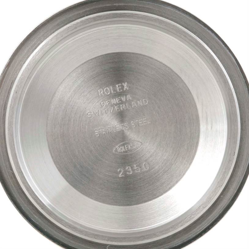 This image shows the inside case back of a Rolex GMT-Master 116710 Men's Stainless Steel Black Dial 116710 Men's Stainless Steel Black Dial watch engraved with "ROLEX, GENEVA, SWITZERLAND, STAINLESS STEEL."