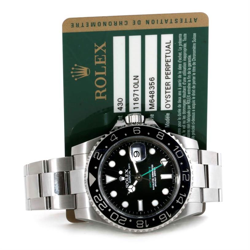 This image shows a front view of the Rolex GMT-Master 116710 Men's Stainless Steel Black Dial 116710 Men's Stainless Steel Black Dial watch with its identification card.