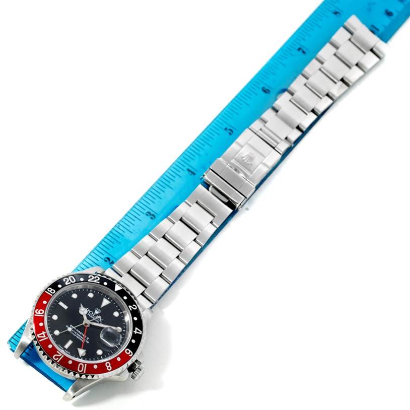 The Rolex GMT-Master 16710 Men's Stainless Steel Black Dial 16710 Men's Stainless Steel Black Dial watch is shown at an overhead angle, featuring the bezel, dial, bracelet, and clasp.