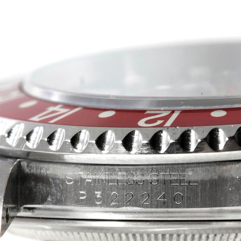 The image shows a close-up side view of a Rolex GMT-Master 16710 Men's Stainless Steel Black Dial 16710 Men's Stainless Steel Black Dial watch, highlighting the bezel, crystal, and part of the case with engravings.