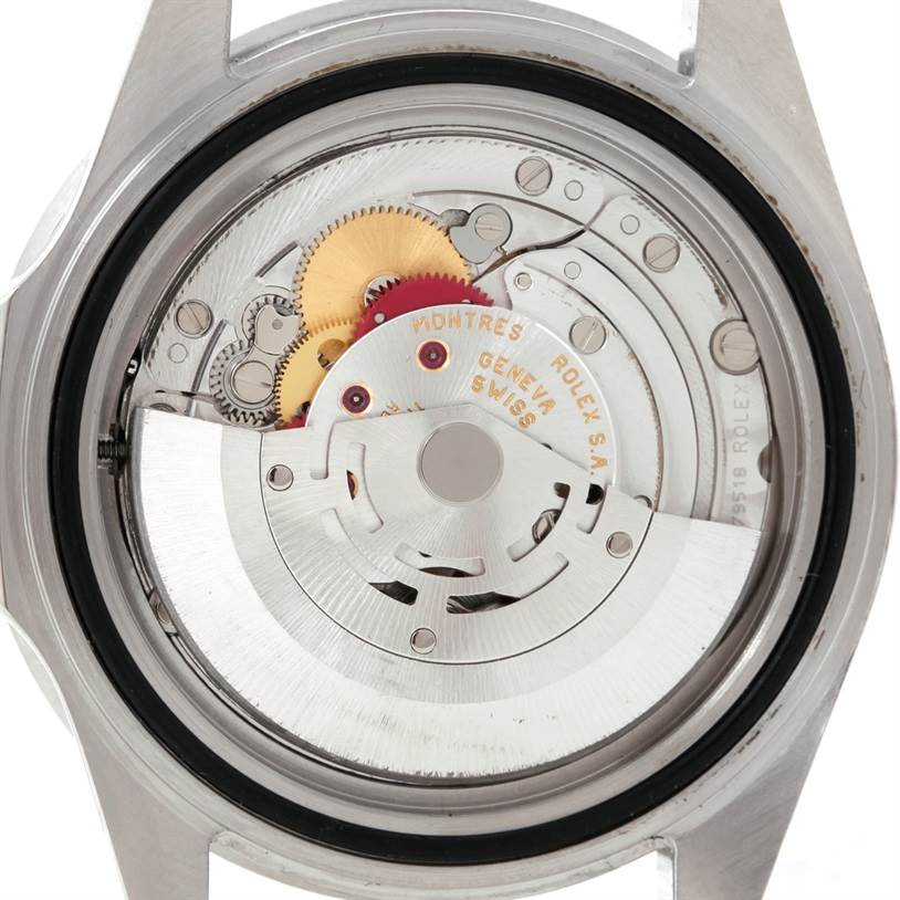 This is the rear view of a Rolex GMT-Master 16710 Men's Stainless Steel Black Dial 16710 Men's Stainless Steel Black Dial showing its intricate internal movement and gears.