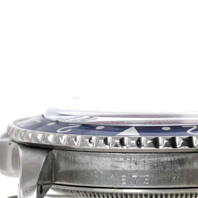 This image shows a side view of the bezel and case of a Rolex GMT-Master 1675 Men's Stainless Steel Black Dial 1675 Men's Stainless Steel Black Dial watch, highlighting model number 1675.
