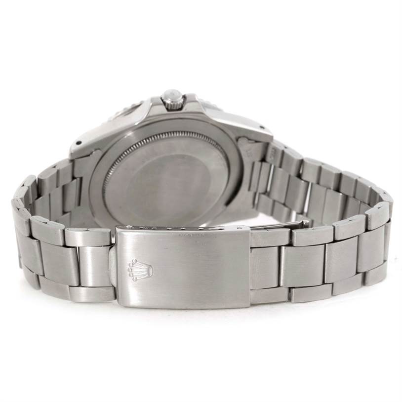 This image shows the back and bracelet of a Rolex GMT-Master 1675 Men's Stainless Steel Black Dial 1675 Men's Stainless Steel Black Dial watch, highlighting the case back and clasp with the Rolex logo.