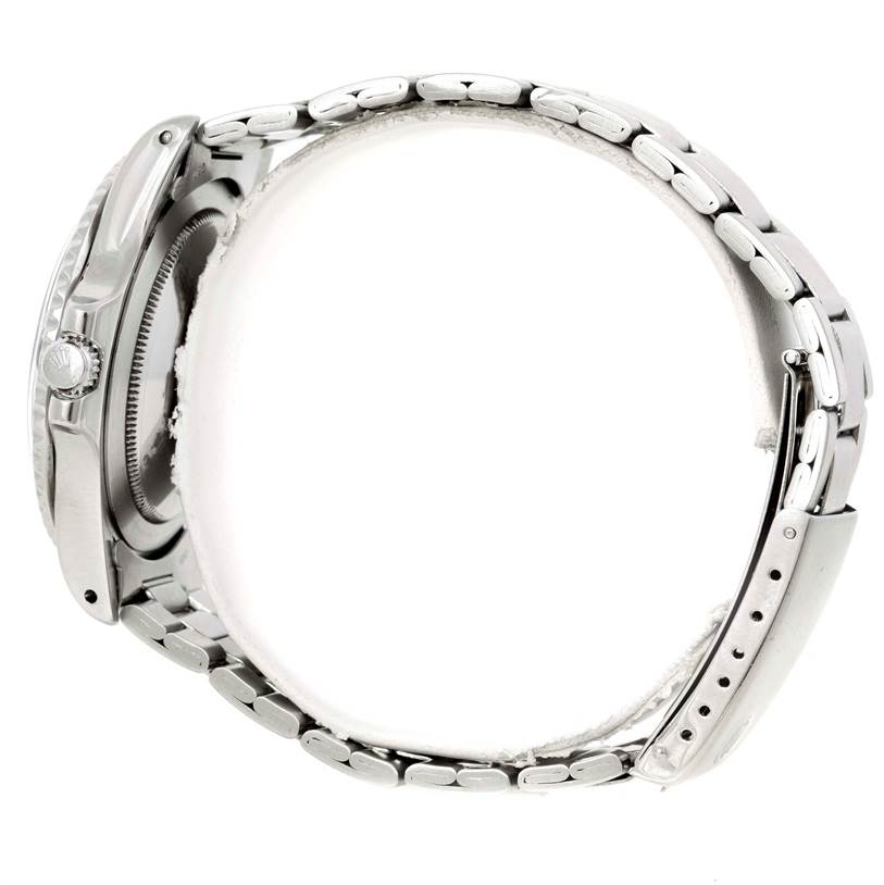 This is a side profile view of a Rolex GMT-Master 1675 Men's Stainless Steel Black Dial 1675 Men's Stainless Steel Black Dial watch, showing the bracelet, crown, and part of the clasp.