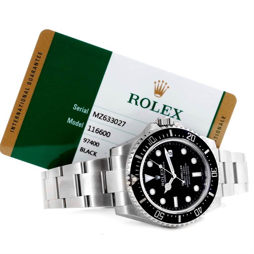 A Rolex Sea-Dweller 116600 Men's Stainless Steel Black Dial 116600 Men's Stainless Steel Black Dial watch is shown at a slight angle, accompanied by its international guarantee card.