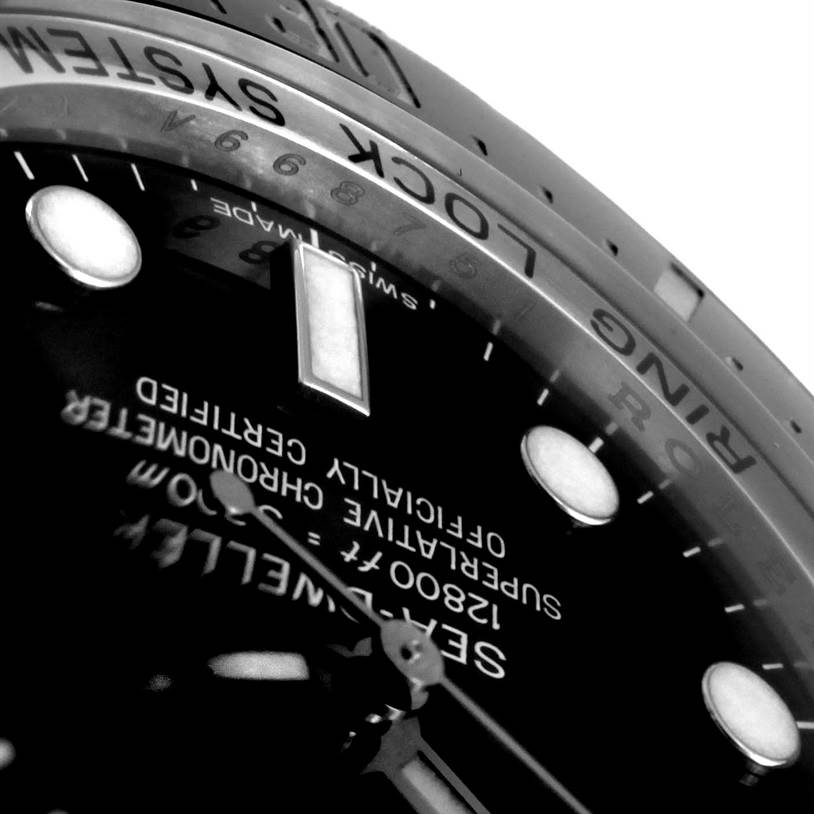 This close-up image of the Rolex Sea-Dweller 116660 Men's Stainless Steel Black Dial 116660 Men's Stainless Steel Black Dial watch focuses on the dial, hands, and part of the case, showing intricate details and markings.