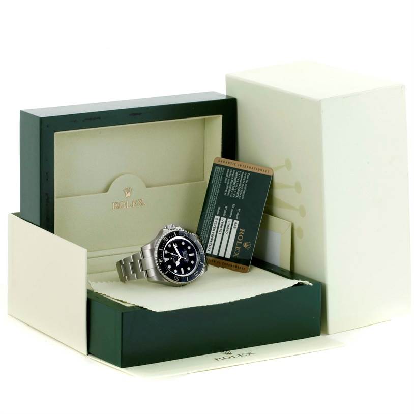 The image shows a Rolex Sea-Dweller 116660 Men's Stainless Steel Black Dial 116660 Men's Stainless Steel Black Dial watch positioned inside its open box along with its warranty card.
