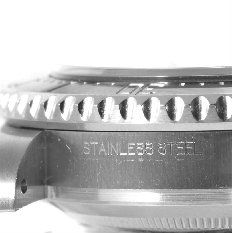 The image shows a close-up side view of the bezel and case of the Rolex Sea-Dweller 116600 Men
s Stainless Steel Black Dial 116600 Men
s Stainless Steel Black Dial watch, highlighting the stainless steel material.