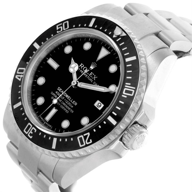 The image shows an angled view of the Rolex Sea-Dweller 116600 Men
s Stainless Steel Black Dial 116600 Men
s Stainless Steel Black Dial watch highlighting its face, bezel, and crown.