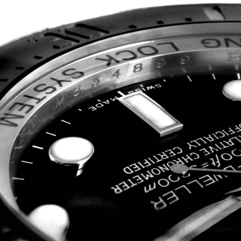The image shows a close-up angle of the dial and bezel of a Rolex Sea-Dweller 116660 Men's Stainless Steel Black Dial 116660 Men's Stainless Steel Black Dial watch, highlighting the markings and some functional details.