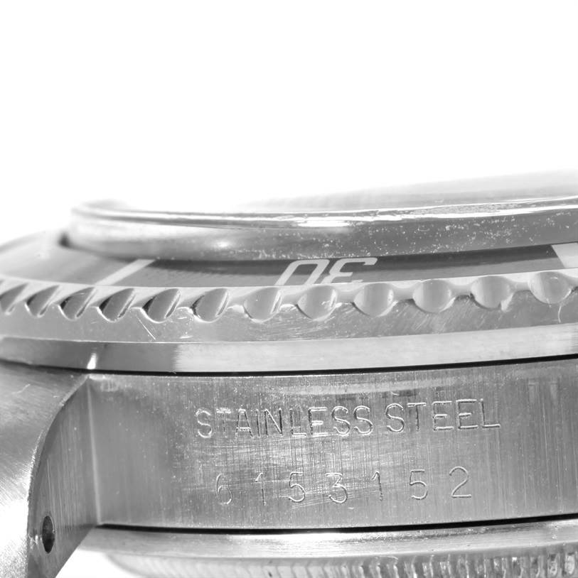 The image shows a close-up side angle of the bezel, case, and engraving on the Rolex Sea-Dweller 1665 Men's Stainless Steel Black Dial 1665 Men's Stainless Steel Black Dial watch.