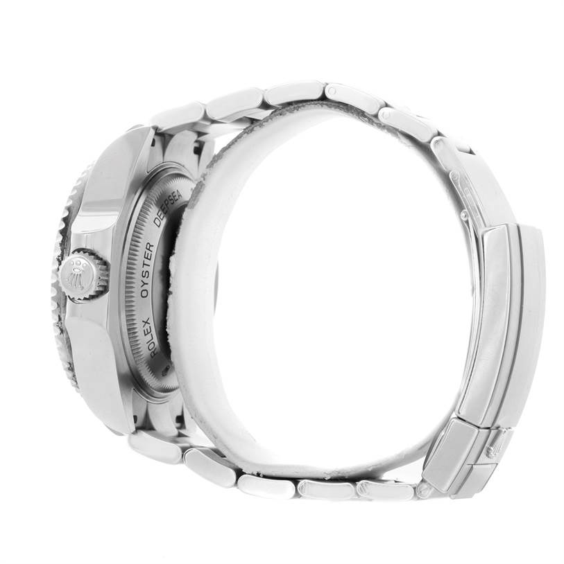 The image shows a side angle of a Rolex Sea-Dweller 116660 Men
s Stainless Steel Blue Dial 116660 Men
s Stainless Steel Blue Dial watch, highlighting the case, crown, and part of the bracelet.