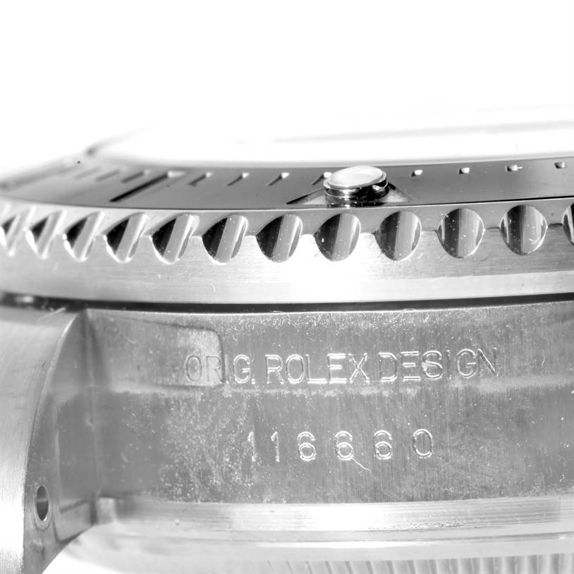 The image shows a close-up angle of the bezel, case, and engraving on the side of a Rolex Sea-Dweller 116660 Men's Stainless Steel Blue Dial 116660 Men's Stainless Steel Blue Dial watch model 16660.