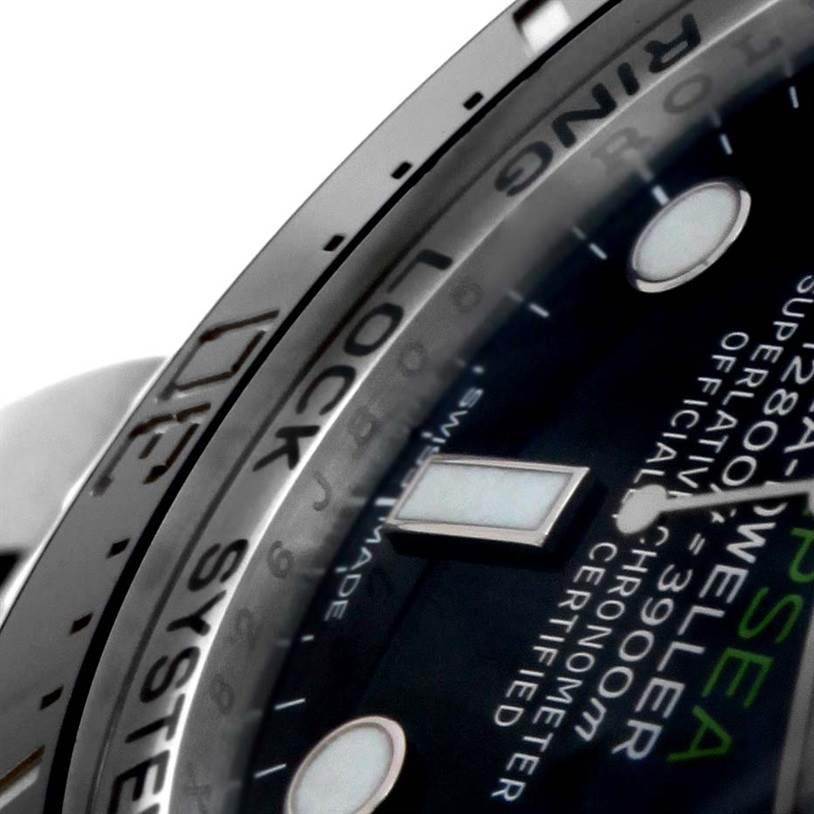 The image shows a close-up of the bezel and part of the dial of a Rolex Sea-Dweller 116660 Men's Stainless Steel Blue Dial 116660 Men's Stainless Steel Blue Dial watch, highlighting the "Ring Lock System."