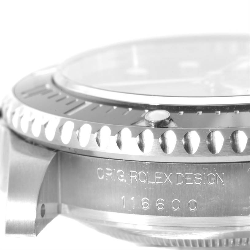 This image shows a close-up of the bezel, case side, and engraving on the Rolex Sea-Dweller 116600 Men's Stainless Steel Black Dial 116600 Men's Stainless Steel Black Dial watch model 116600.