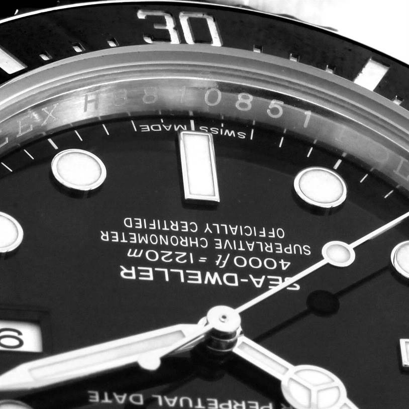 The image shows a close-up of the dial and part of the bezel of a Rolex Sea-Dweller 116600 Men's Stainless Steel Black Dial 116600 Men's Stainless Steel Black Dial watch, highlighting the markings and hands.