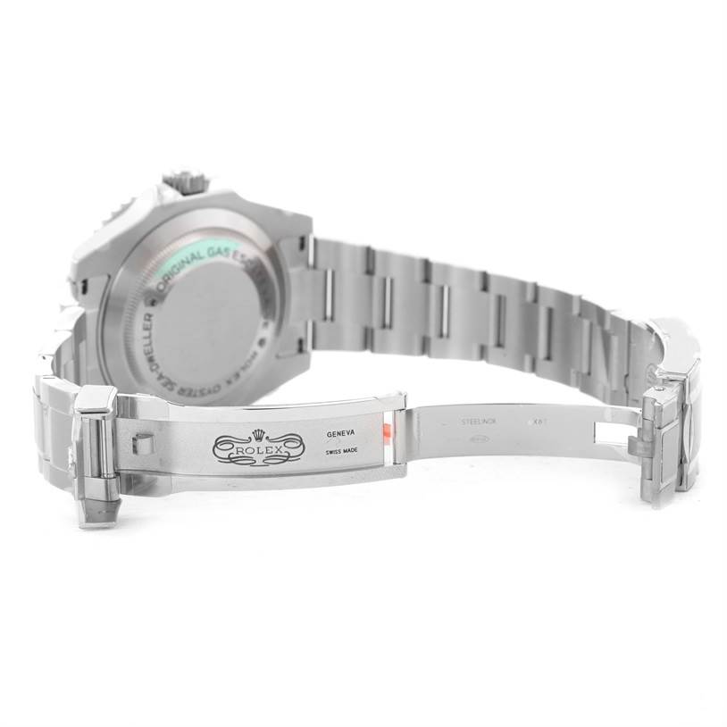 The image shows the backside and opened clasp of a Rolex Sea-Dweller 116600 Men's Stainless Steel Black Dial 116600 Men's Stainless Steel Black Dial watch, highlighting its Oyster bracelet and engraved case back.