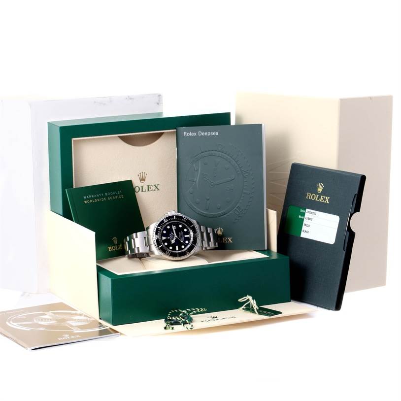 The image shows a Rolex Sea-Dweller 116660 Men's Stainless Steel Black Dial 116660 Men's Stainless Steel Black Dial watch positioned in its open box with accompanying booklets and warranty card.