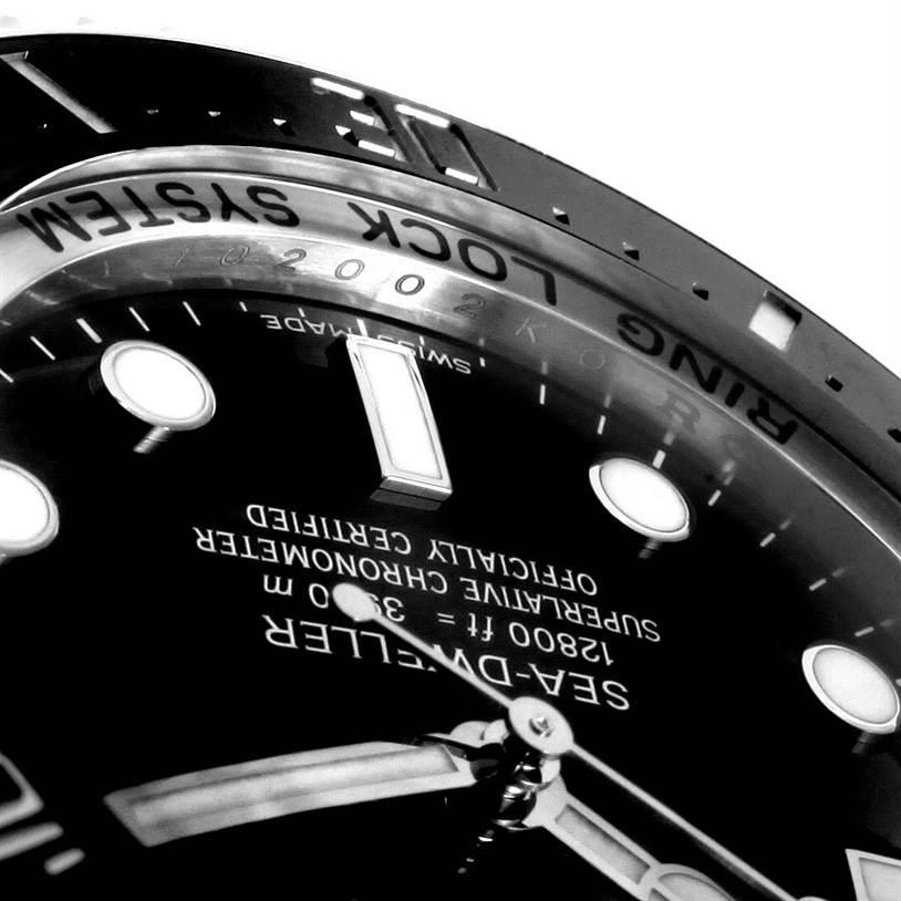 The image shows a close-up angle of the dial and bezel of a Rolex Sea-Dweller 116660 Men's Stainless Steel Black Dial 116660 Men's Stainless Steel Black Dial watch.