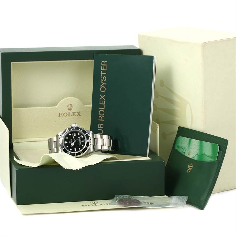 The image shows a Rolex Sea-Dweller 16600 Men's Stainless Steel Black Dial 16600 Men's Stainless Steel Black Dial watch in its box, along with a booklet, a cardholder, and other accessories.