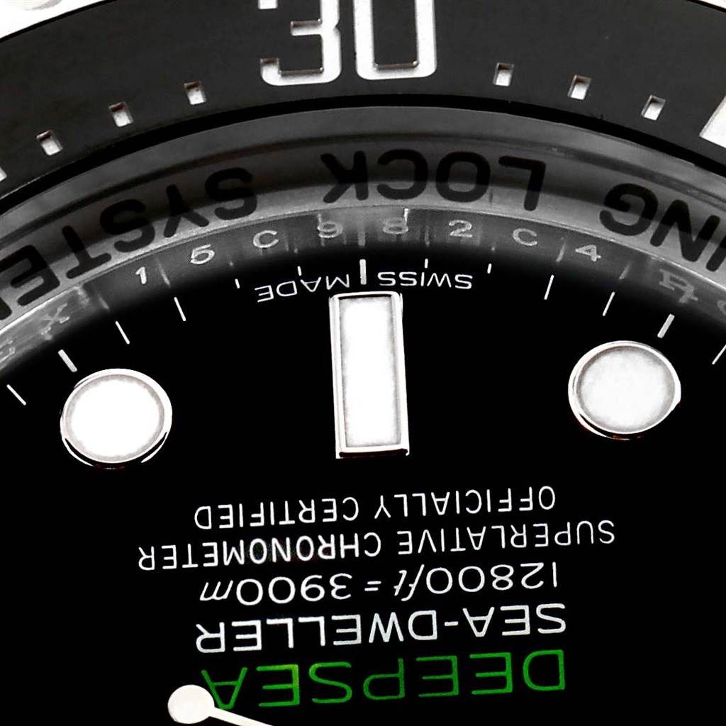 This close-up image of a Rolex Sea-Dweller 116660 Men
s Stainless Steel Blue Dial 116660 Men
s Stainless Steel Blue Dial watch shows its dial, text details, and part of the bezel at an upward angle.